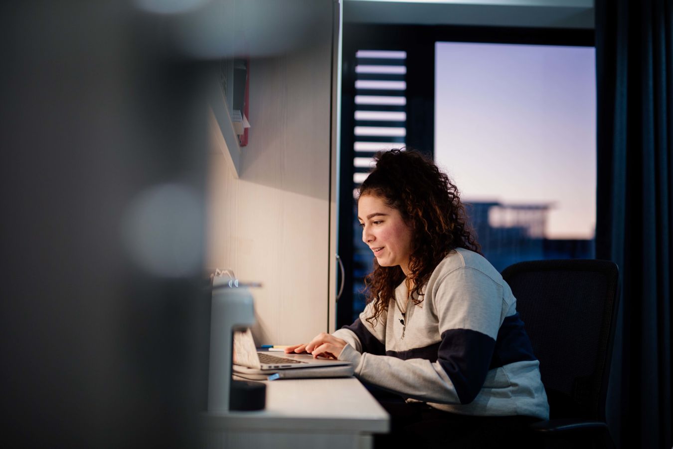 Student studying on a laptop in The Courtyard