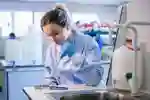 PhD student Amber uses a pipette in a medical laboratory