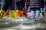 Covered legs wading through water