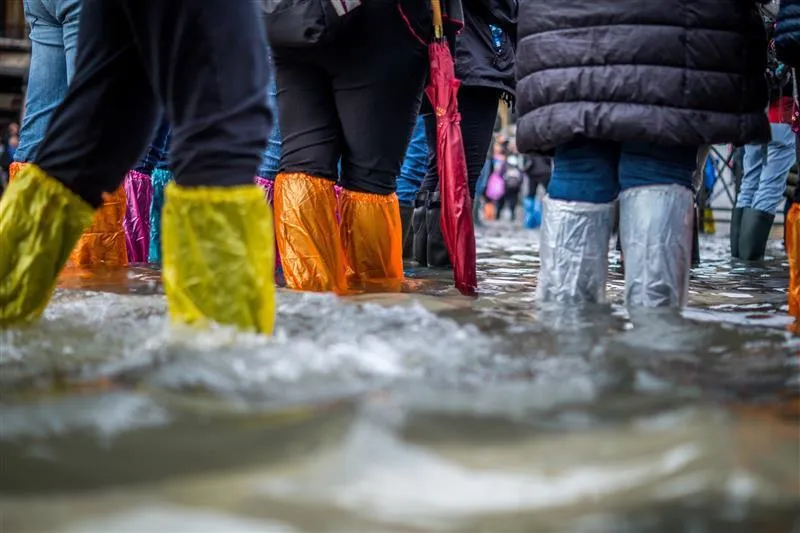 Covered legs wading through water