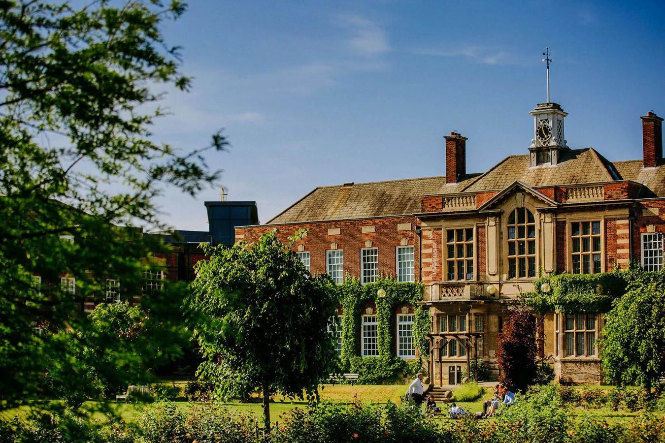 Students walk past the front of one of the University's grade 2 listed buildings