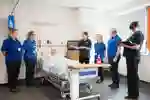 A practical session using a mannequin in a simulated hospital ward