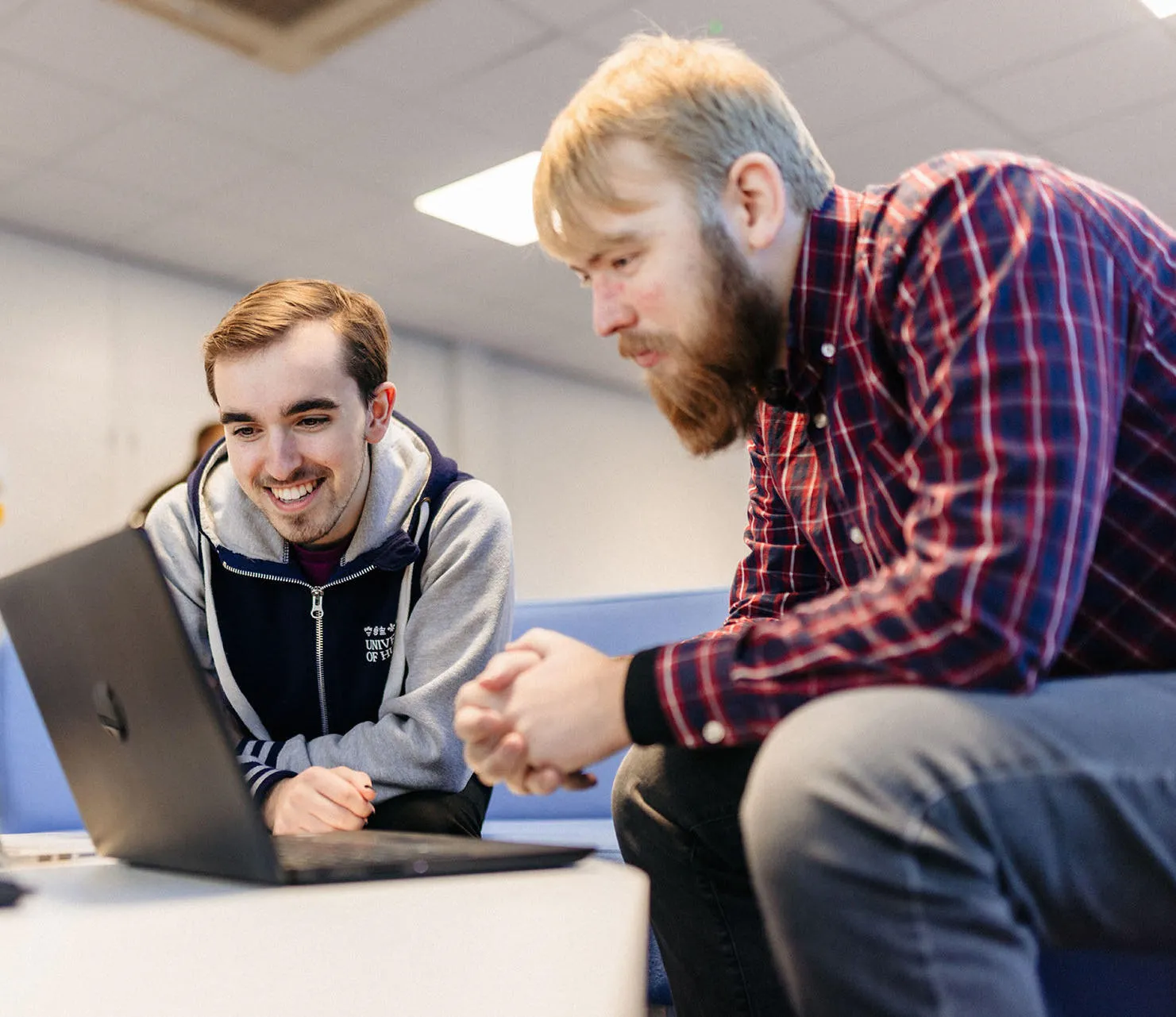 Students looking at laptops