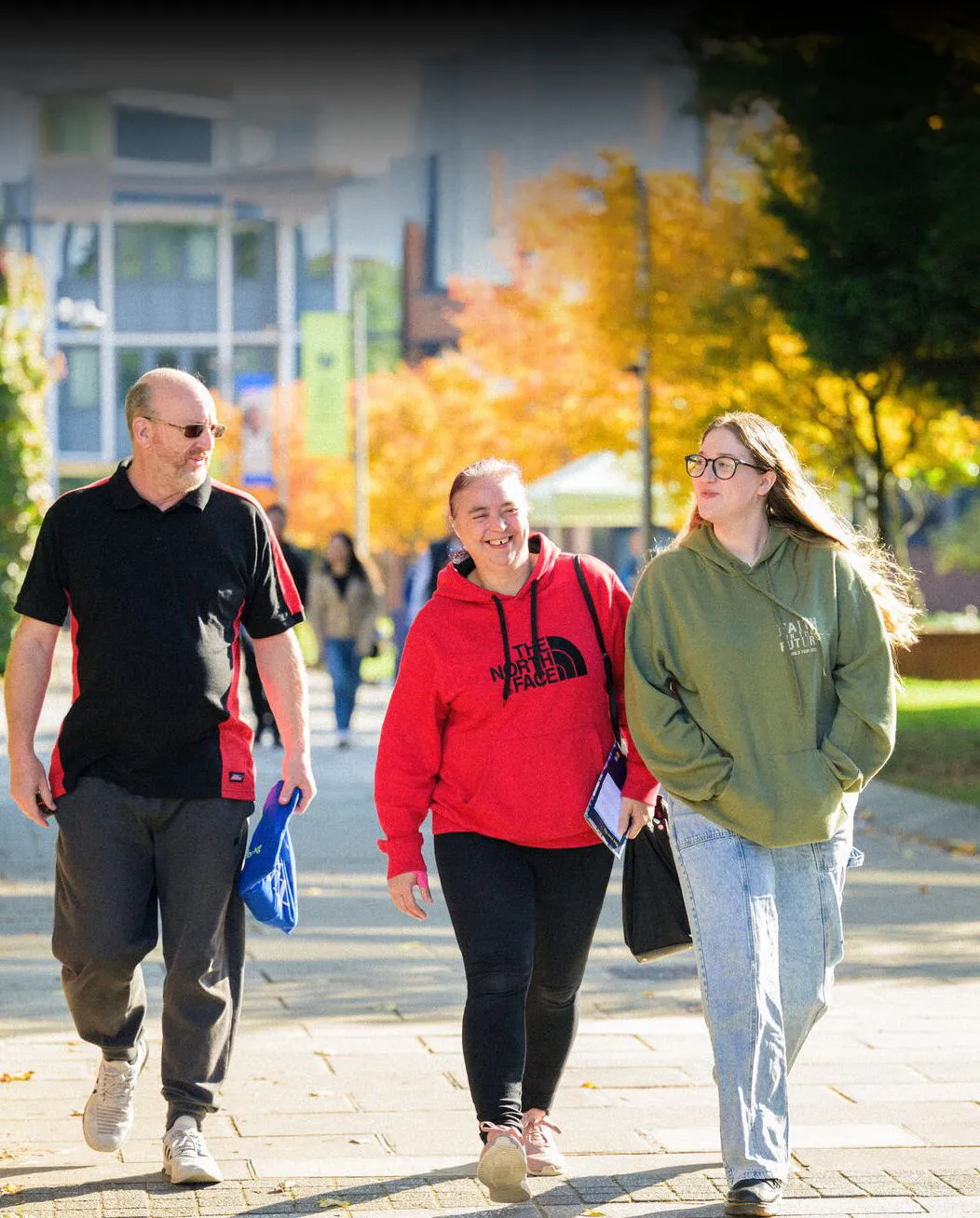 A student exploring campus with parents