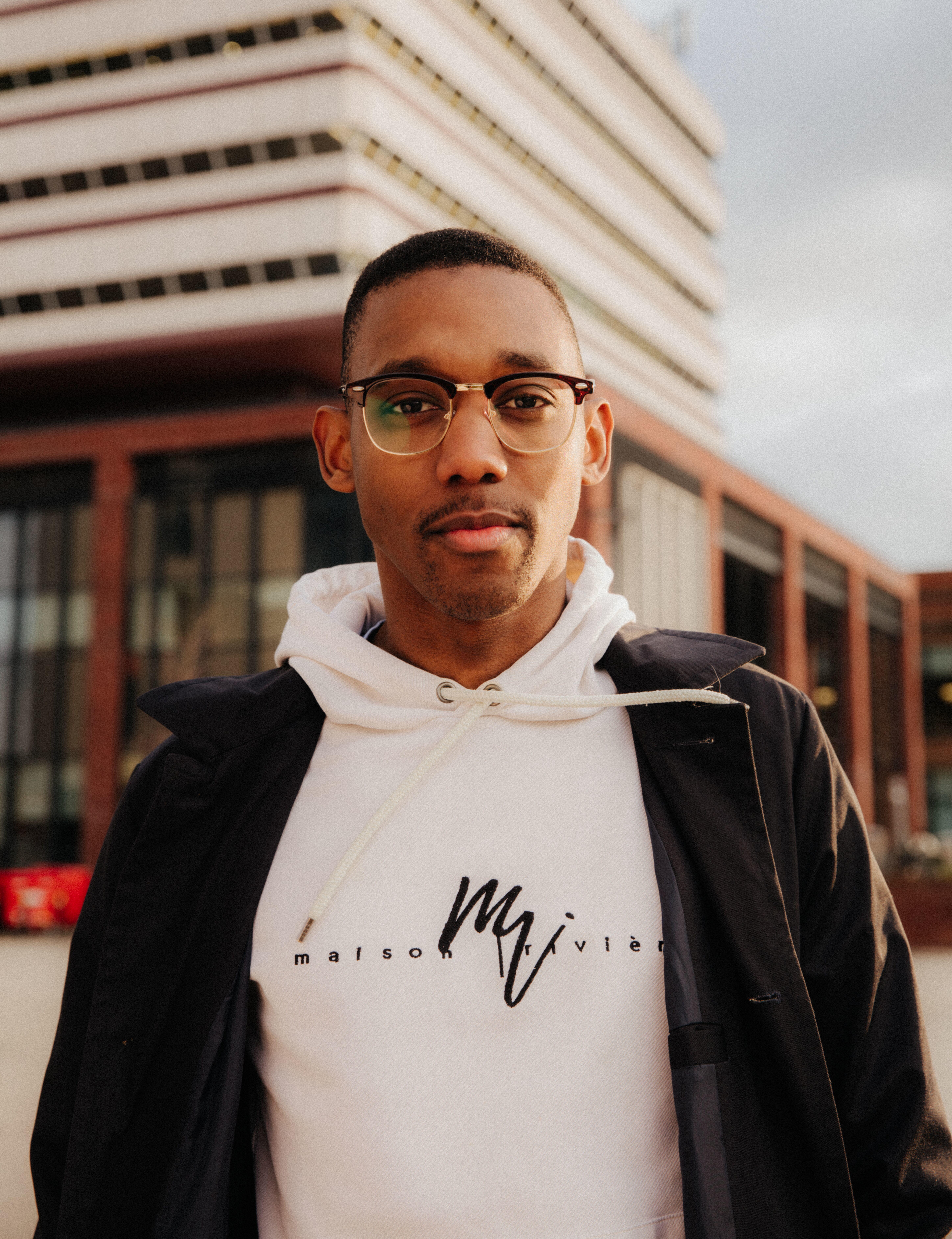 Student Ano stands smiling confidently outside the Brynmor Jones Library.